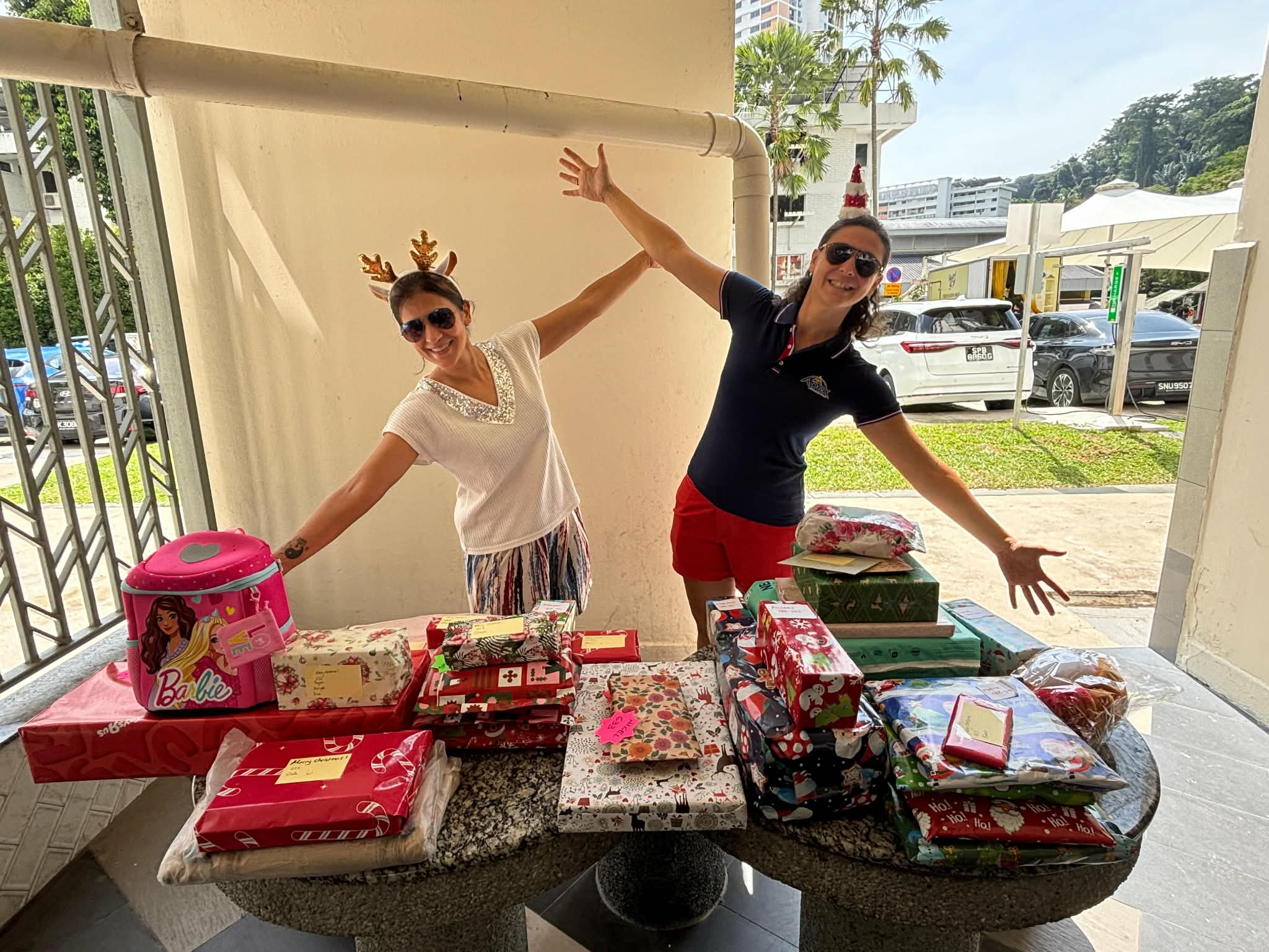 Santas and Santarinas brought Christmas gifts to Apex!